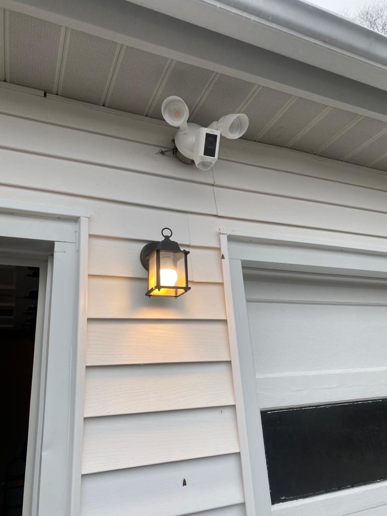 Smart floodlight camera on a house